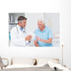 Doctor explaining prescription to senior patient Wall Mural