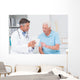 Doctor explaining prescription to senior patient Wall Mural