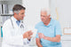 Doctor Explaining Prescription To Senior Patient Wall Decal