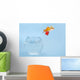 Goldfisch springt aus Glas Wall Mural