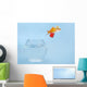 Goldfisch springt aus Glas Wall Mural