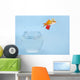 Goldfisch springt aus Glas Wall Mural