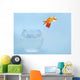 Goldfisch springt aus Glas Wall Mural