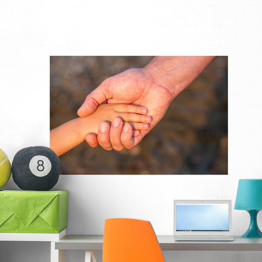 Father's hand lead his child son in summer forest nature  Wall Mural
