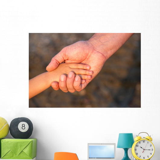 Father's hand lead his child son in summer forest nature  Wall Mural