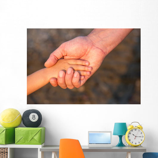 Father's hand lead his child son in summer forest nature  Wall Mural