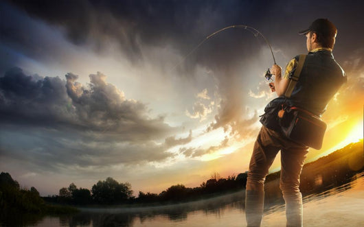 Young Man Fishing At Dramatic Sunset Wall Decal