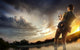Young Man Fishing At Dramatic Sunset Wall Decal