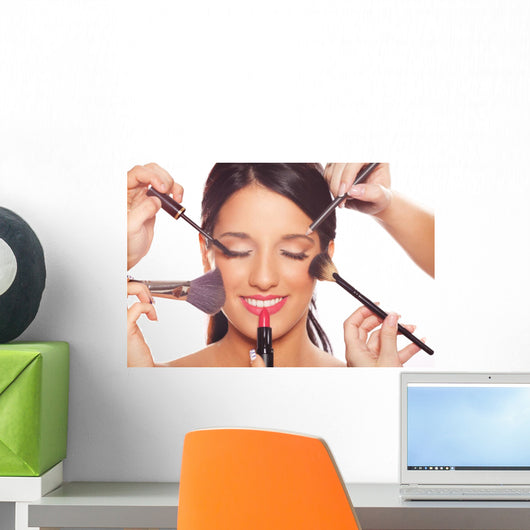 Young woman getting professional beauty and makeup treatment Wall Mural