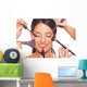 Young woman getting professional beauty and makeup treatment Wall Mural