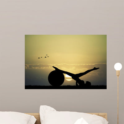 Pilates Silhouette At Sunset Wall Decal shown on a wall