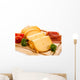 Cheese on cutting board on white background Wall Mural
