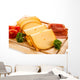 Cheese on cutting board on white background Wall Mural