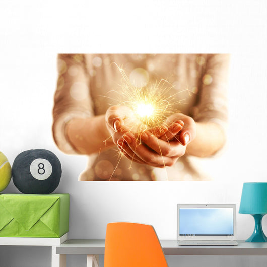 Hands with sparkler light isolated on white Wall Mural