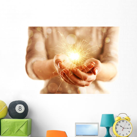 Hands with sparkler light isolated on white Wall Mural