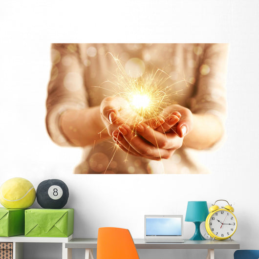 Hands with sparkler light isolated on white Wall Mural