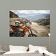 Dirty enduro motorcycle motocross helmet on road Wall Mural