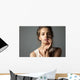 Pretty young woman watching at camera Wall Mural