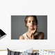 Pretty young woman watching at camera Wall Mural