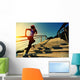 young fitness woman running on seaside stone stairs Wall Mural