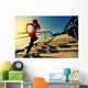 young fitness woman running on seaside stone stairs Wall Mural