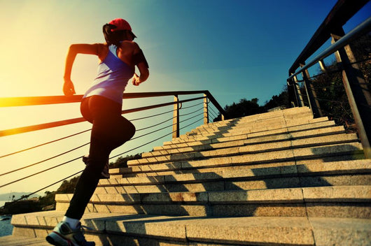 Young Fitness Woman Running On Seaside Stone Stairs Wall Decal