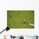 Golf club and golf ball on the putting green beside flag Wall Mural