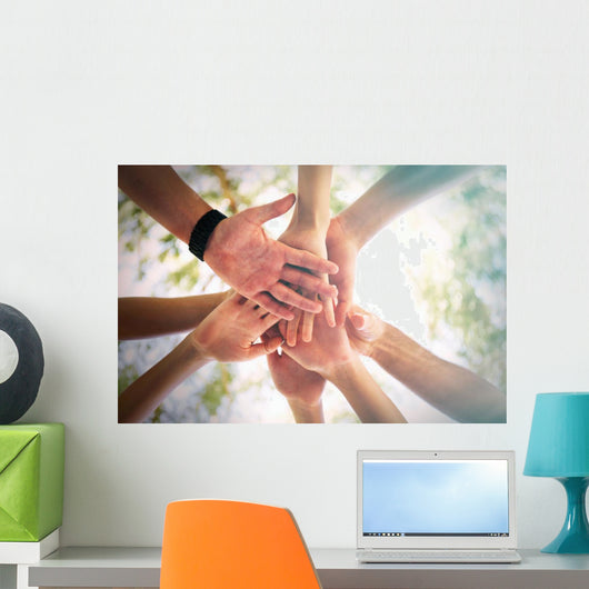 Hands of young people close up on sunny nature background Wall Mural