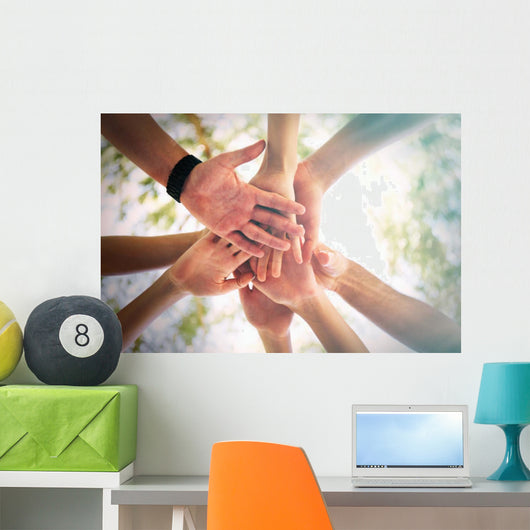 Hands of young people close up on sunny nature background Wall Mural