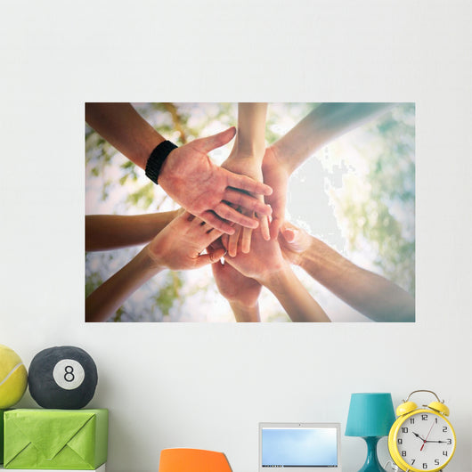 Hands of young people close up on sunny nature background Wall Mural