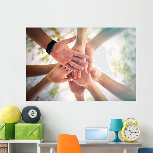 Hands of young people close up on sunny nature background Wall Mural
