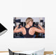 Strong woman shows her muscles Wall Mural