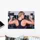 Strong woman shows her muscles Wall Mural