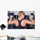 Strong woman shows her muscles Wall Mural