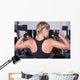 Strong woman shows her muscles Wall Mural