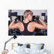 Strong woman shows her muscles Wall Mural