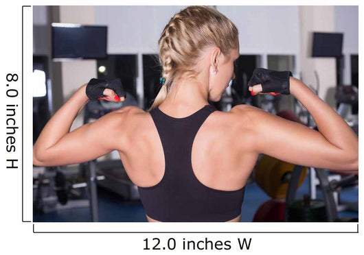 Strong woman shows her muscles Wall Mural