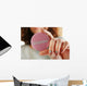 Round volunteer button in hand close-up Wall Mural