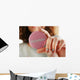 Round volunteer button in hand close-up Wall Mural