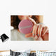 Round volunteer button in hand close-up Wall Mural