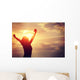 cheering woman open arms at sunrise seaside Wall Mural