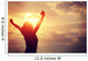 cheering woman open arms at sunrise seaside Wall Mural