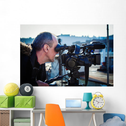 cameraman shooting outdoor Wall Mural