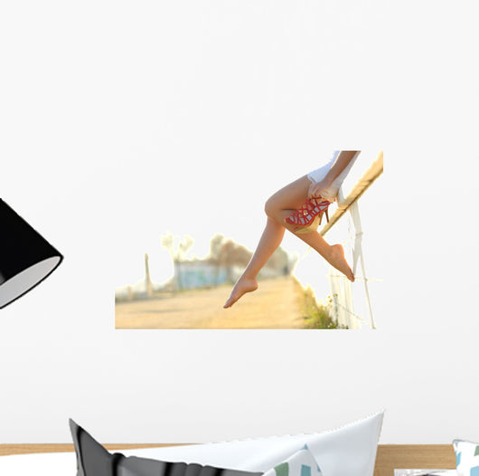 Woman legs silhouette with heels hanging of her hands Wall Mural