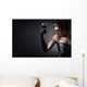 young woman in carnival mask and a glass of red wine. Wall Mural
