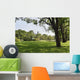 Green grass field in big city park Wall Mural