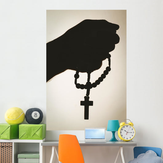 Hand holding rosary beads Wall Mural