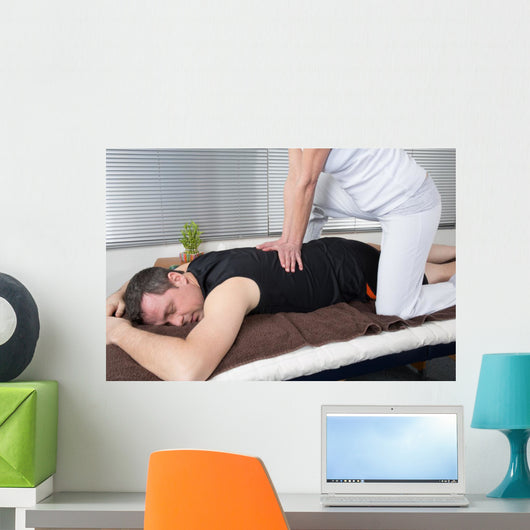 One man and woman performing back shiatsu massage Wall Mural