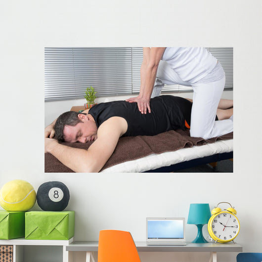 One man and woman performing back shiatsu massage Wall Mural