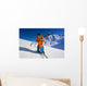 Father give mountain ski lesson to little boy Wall Mural